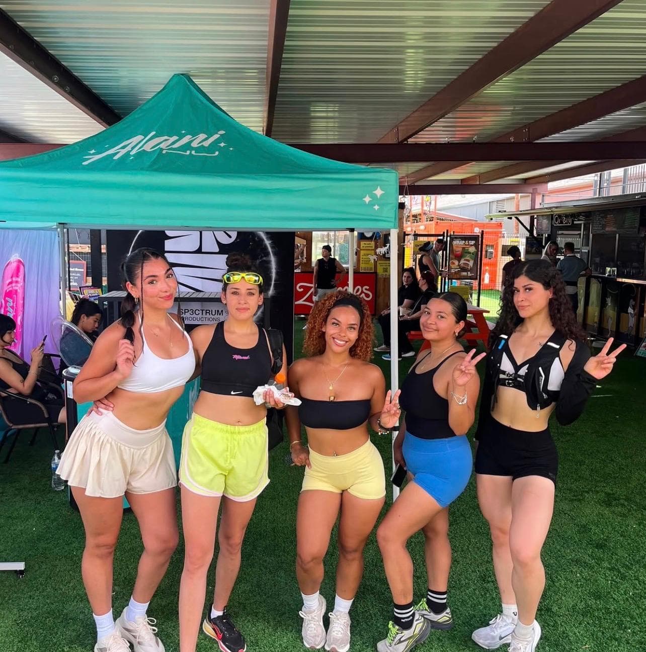 AM Club members together at a partner tent after the run