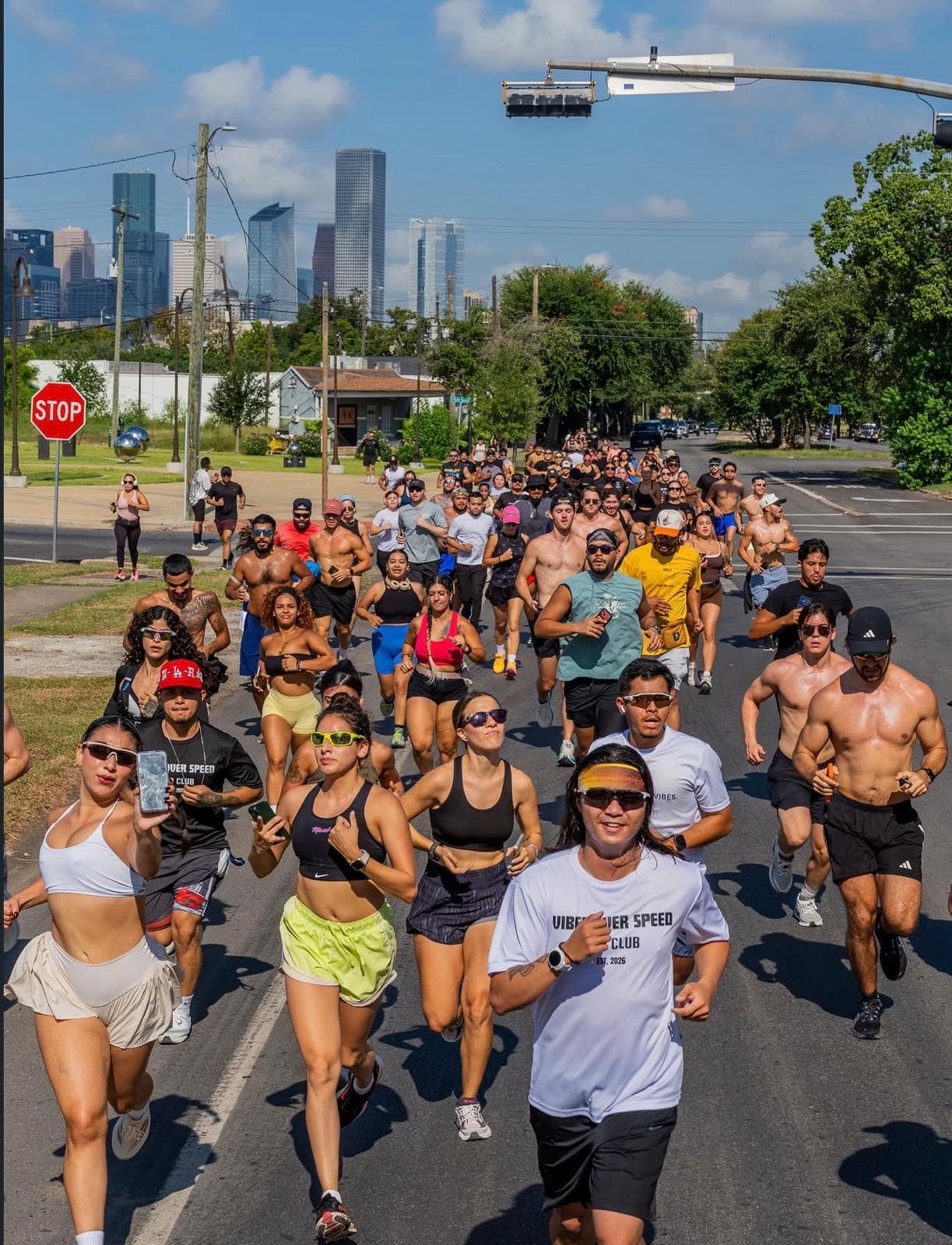 A large AM Club run on a Houston street, skyline in the background